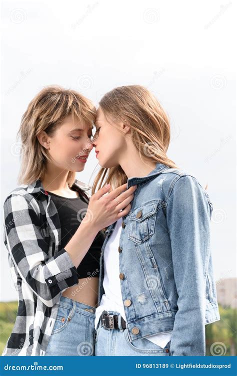 women kissing each other|Authentic LGBT female lesbian couple kissing each other in slow。